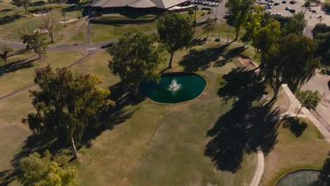 orbiting-aerial-drone-shot-of-a-fountain-on-a-golf-course