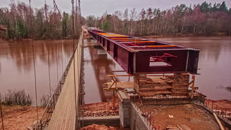Long-time-lapse-of-a-steel-bridge-being-constructed-over-the-Gauja-River-in-Latvia