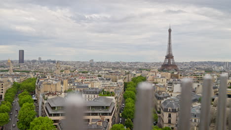Handheld-view-of-the-Eiffel-tower-in-Paris,-France-from-the-Arc-de-Triomphe