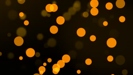 Group-of-animated-orange-circle-particles-moving-on-bokeh-background