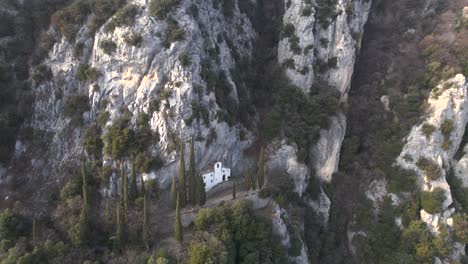 Drone-shot-showcasing-Eremo-di-San-Valentino-and-Cima-Comer,-two-popular-destinations-for-hikers-on-Lake-Garda