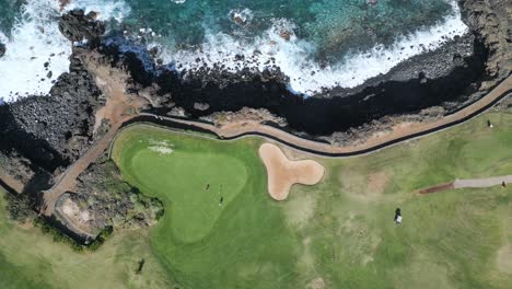 High-angle-aerial-view-of-a-golf-course-near-the-ocean-in-Tenerife