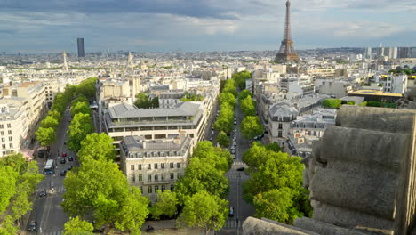 Tilt-up-view-of-the-Eiffel-tower-in-Paris,-France-from-the-Arc-de-Triomphe-on-a-sunny-day