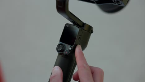 Activating-with-finger-new-modern-DJI-RS3-stabilizer-gimbal