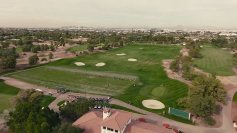 push-in-aerial-drone-shot-of-a-golf-course-driving-range