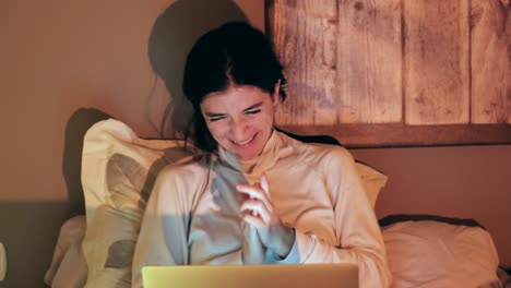 Young-Woman-Enjoying-Content-on-Laptop
