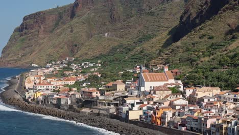 Paul-do-Mar-Church-and-town-centre,-Madeira-Portugal,-drone-telephoto-establishing-shot