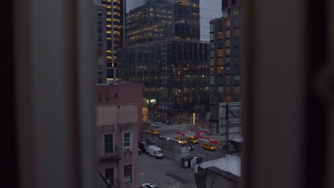 Blue-hour-establishing-shot-of-the-Spiral-66-Hudson-Boulevard-skyscraper-in-New-York-City---Midtown-Manhattan---apartment-window-POV