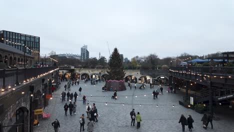 Overlooking-Coals-Drops-Yard-With-Festive-Christmas-Lighting-And-Large-Tree-In-Kings-Cross,-London