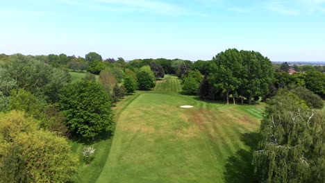 Reverse-Aerial-Flyover-of-Golf-Course-and-Fairway
