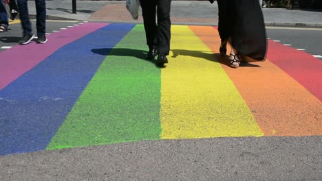 Rainbow-street-pedestrian-crossing-at-intersection-in-London-for-gay-pride,-pride-month,-low-angle-shot,-static-camera,-day-,real-time