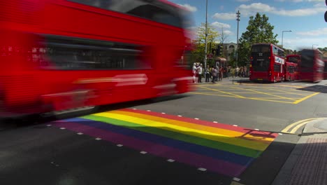 Time-lapse-of-intersection-in-london-with-rainbow-paedestrian-crossing-for-gay-pride,-pride-month,-eye-level-shot,-static-camera,-day