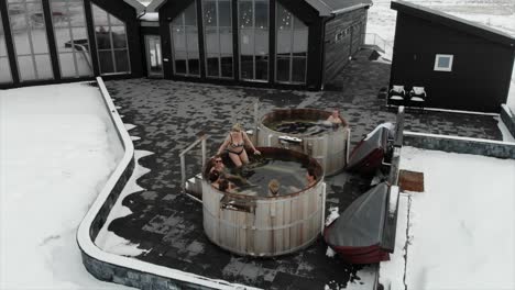 People-in-bathing-suits-enjoy-a-nice-outdoor-hot-tub-in-Iceland