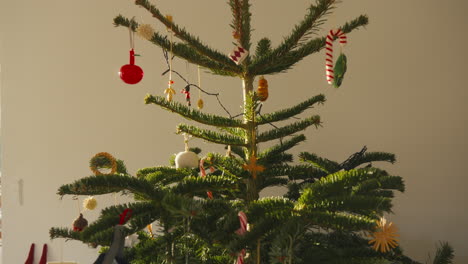 Decorated-Christmas-tree-adorned-with-an-assortment-of-traditional-ornaments