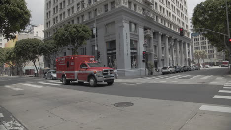 Slow-Motion-of-ambulance-driving-down-street-in-Los-Angeles,-CA