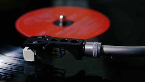 Closeup-needle-on-spinning-vintage-vinyl-record-on-turntable