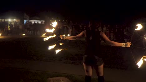 Two-fire-dancer-girls-walking-with-fire-circles