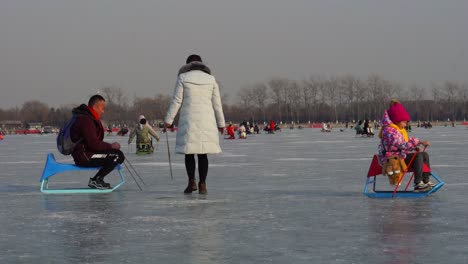 Summer-Palace-sledding-slow-motion-family-winter-frozen-lake