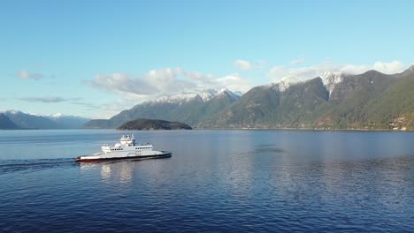 Aerial-of-BC-Ferries-ferry-crossing-beautiful-snow-capped-mountainous-landscape