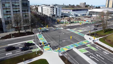 Circular-aerial-shot-of-UBC's-new-intersection-featuring-colourful-camo-crosswalks