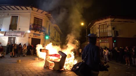 People-celebrating-New-Years-eve-with-bonfire-in-the-streets-of-Cuenca,-Ecuador
