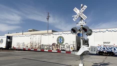 Long-train-slowly-moving-passed-Bakersfield-California-court-house-parking