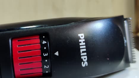 Slomo-close-up-panning-shot-of-a-switched-on-Philips-beard-trimmer