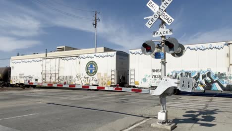 Long-train-slowly-moving-passed-Bakersfield-California-court-house-parking