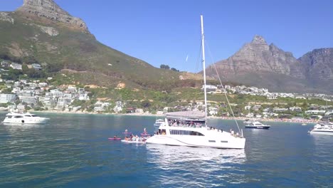 Catamaran-yacht-off-the-coast-of-Clifton-beach-in-Cape-Town,-South-Africa