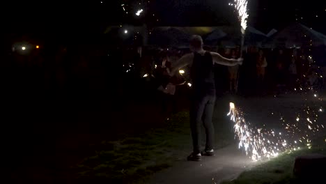 Fire-dancer-spinning-fireworks-behind-his-back