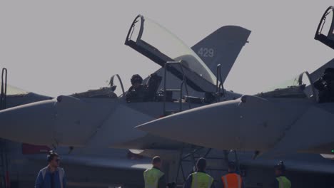 Raf-Eurofighter-Typhoon-Jet-Aircraft-stationed-at-RAF-Coningsby-Lincolnshire-preparing-for-runway-taxi-and-take-off-service-engineers-seen-as-well-as-the-aircraft-pilot