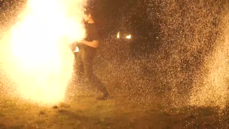 Fire-dancer-with-big-care-gets-lost-in-fireballs