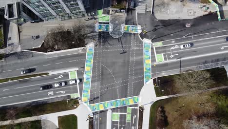 Lowering-aerial-shot-of-UBC's-new-intersection-featuring-colourful-camo-crosswalks