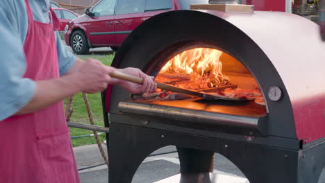 Pizzas-Cooking-in-Wood-fired-Oven-at-Night-Market