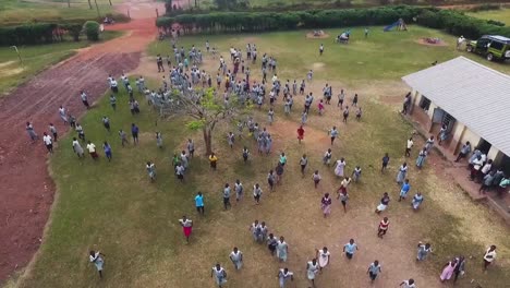 Aerial-view-of-African-children-trying-to-catch-a-drone