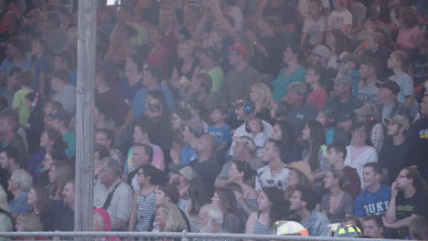 Wide-Shot-of-Crowd-Watching-an-Event,-Some-Clapping-Their-Hands,-Slow-Motion