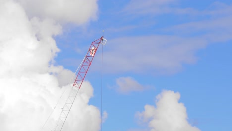 Close-up-of-a-crane-against-a-cloudy-sky