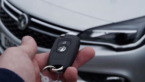 A-car-key-opens-our-rented-car-at-the-airport