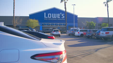 -Static-shot-of-Lowe's-Home-Improvement-store-front-and-parking-lot-at-5:35pm