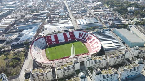Camera-fly-and-tilt-down-of-empty-Huracan-football-club-stadium