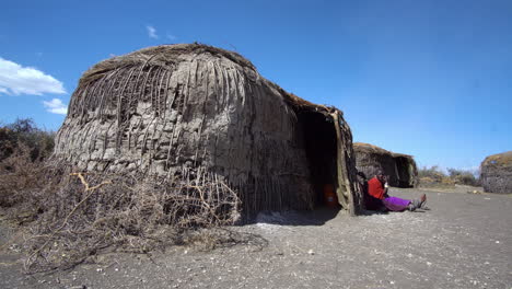 Member-of-African-Maasai-Tribe-Sitting-in-Front-of-Hut