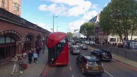 Timelapse-from-London-Bus-front-seat-of-people,-buses-and-traffic-with-sight-of-King's-Cross,-St-Pancras-and-Pentonville-Road