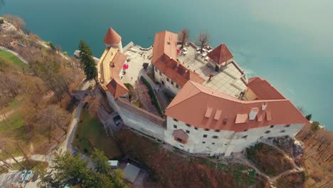 Drone-left-side-rotating-bird-eye-flying-view-of-lake-Bled-castle-on-cliff