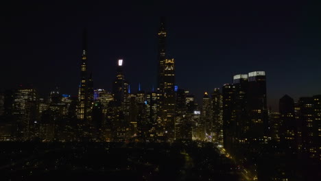 Drone-shot-of-the-Central-park-and-supertall-skyscrapers-of-Billionaires'-Row,-night-in-New-York,-USA