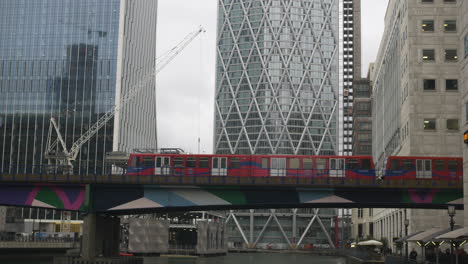 A-train-Passing-on-a-railway-bridge-in-canary-wharf-into-the-DLR-station