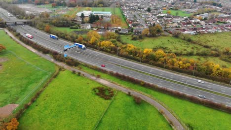 Aerial-view-across-Lancashire-countryside-busy-M6-motorway-traffic-England