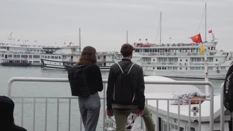 Tourist-Couple-Waiting-At-The-Cruise-Port-Of-Halong-Bay-In-Vietnam