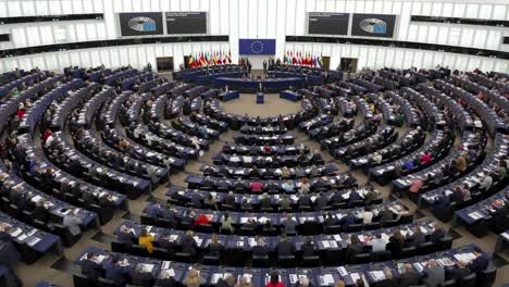 Members-arriving-in-the-European-Parliament-Room,-debating-chamber-in-Strasbourg,-France---Time-Lapse