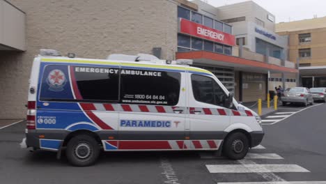 Ambulance-at-hospital-exits-with-paramedics