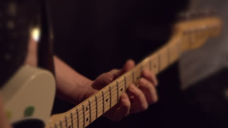 Dreamy-Blurry-Bokeh-of-Guy-Playing-Telecaster-Style-Electric-Guitar